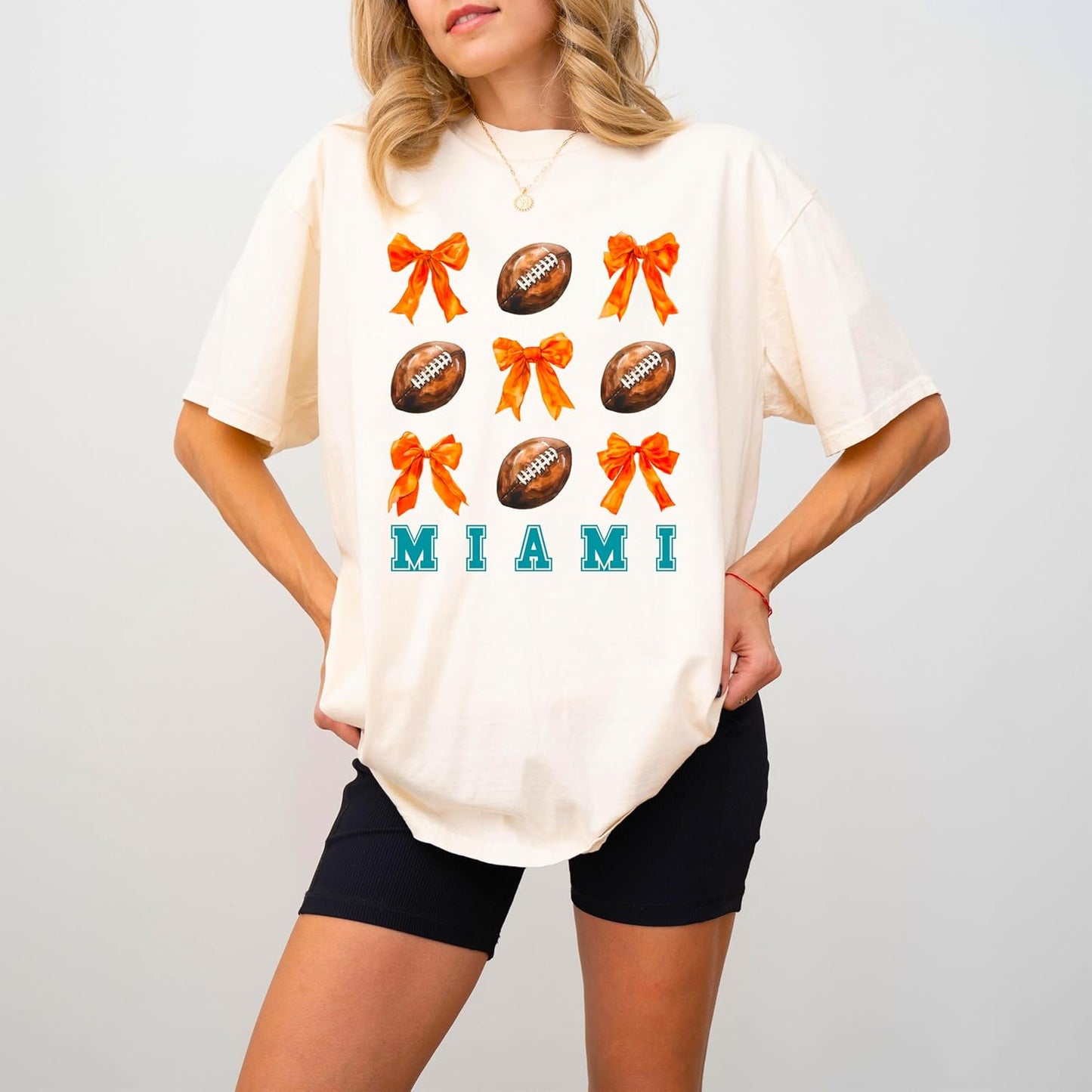 Trendy Miami Football Shirt for Women and Teens Girly Orange Bows and Footballs Florida Team Tee
